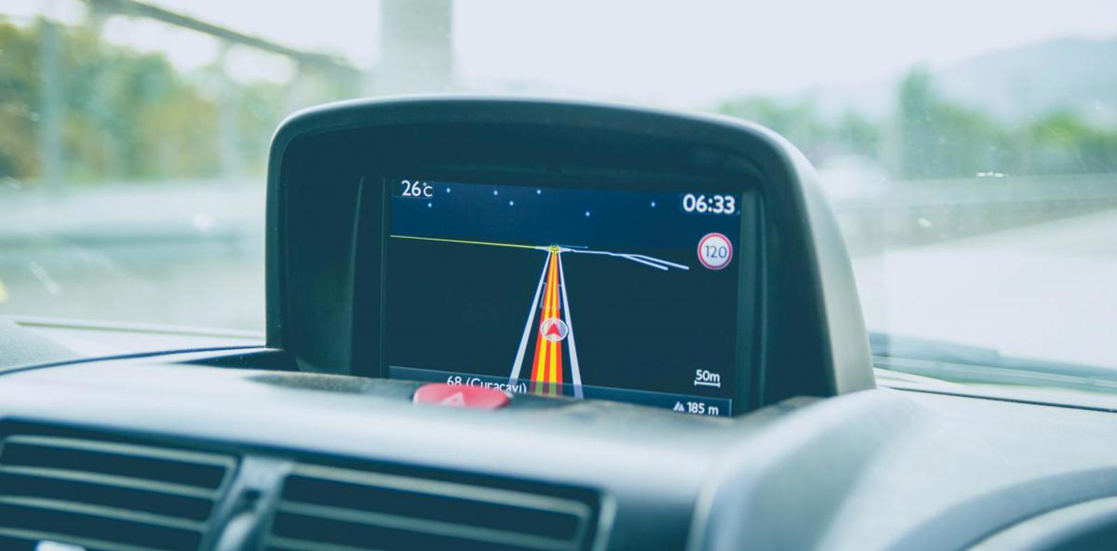 A car dashboard with a GPS navigation system displaying directions and maps for easy navigation.