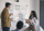 UI/UX designer and software engineers discussing mockups.