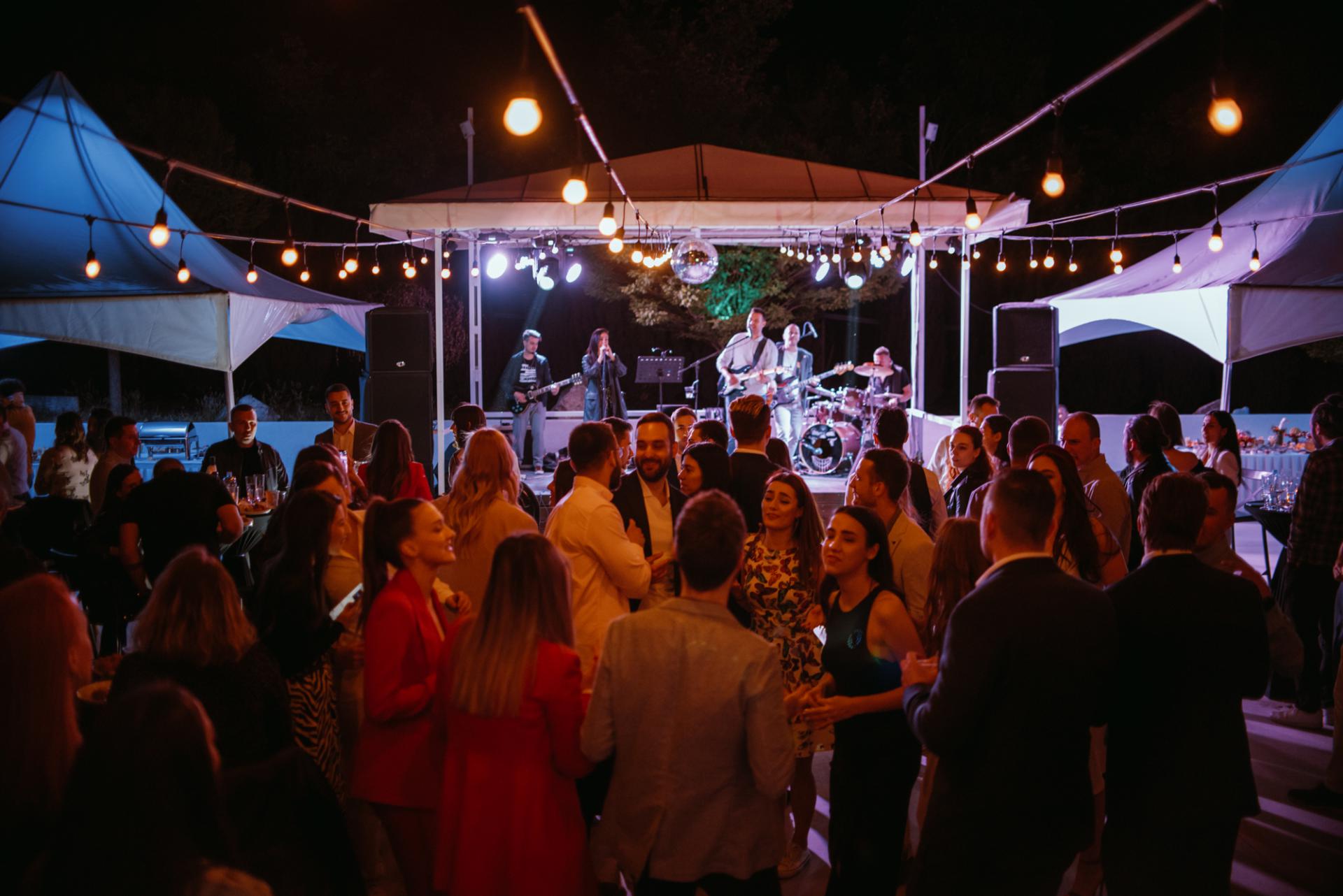 A joyful gathering of people celebrating at a party, filled with laughter, dancing, and love.