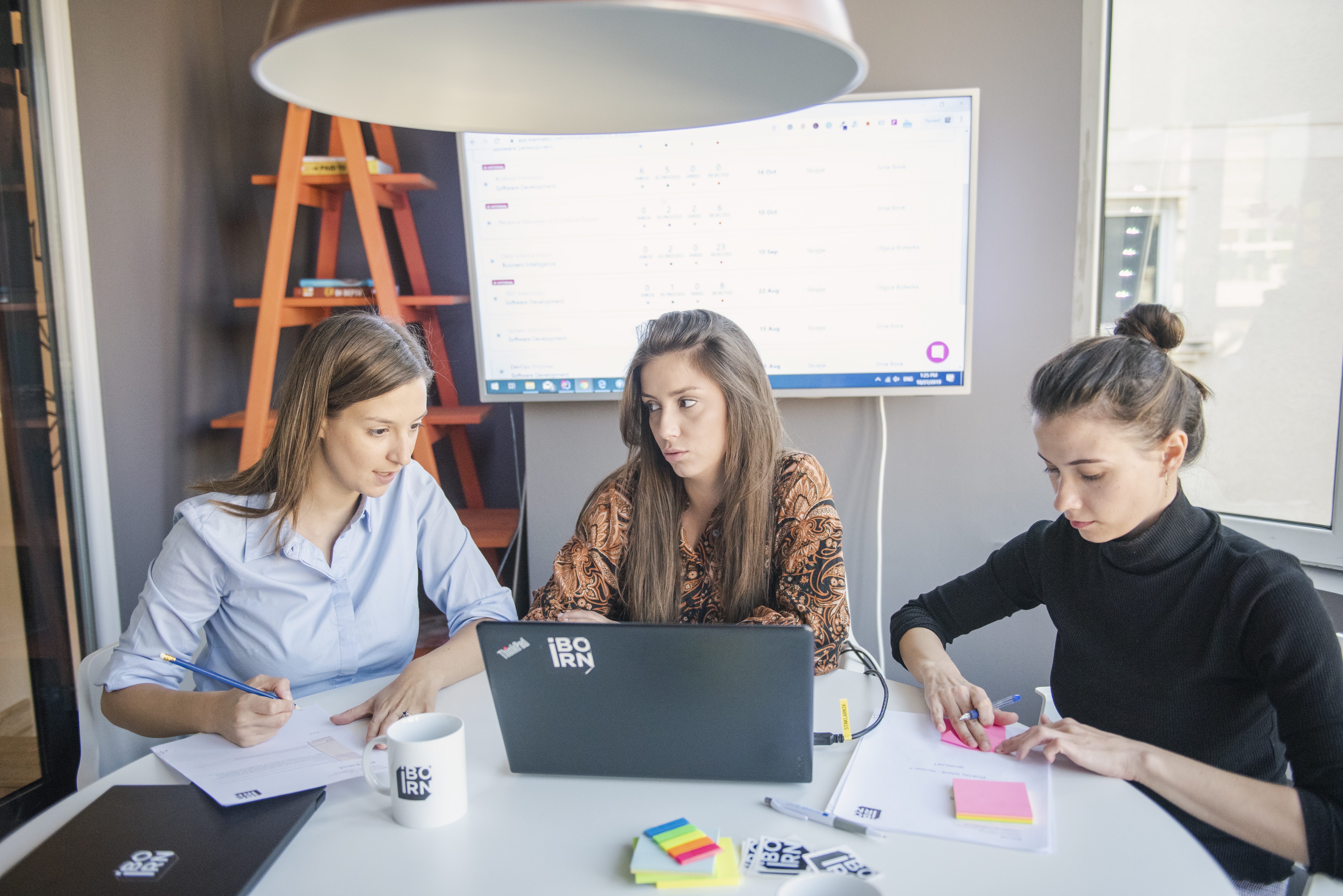 UI/UX team working together in a bright office.