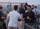 People enjoying drinks on a rooftop terrace with a stunning cityscape view.