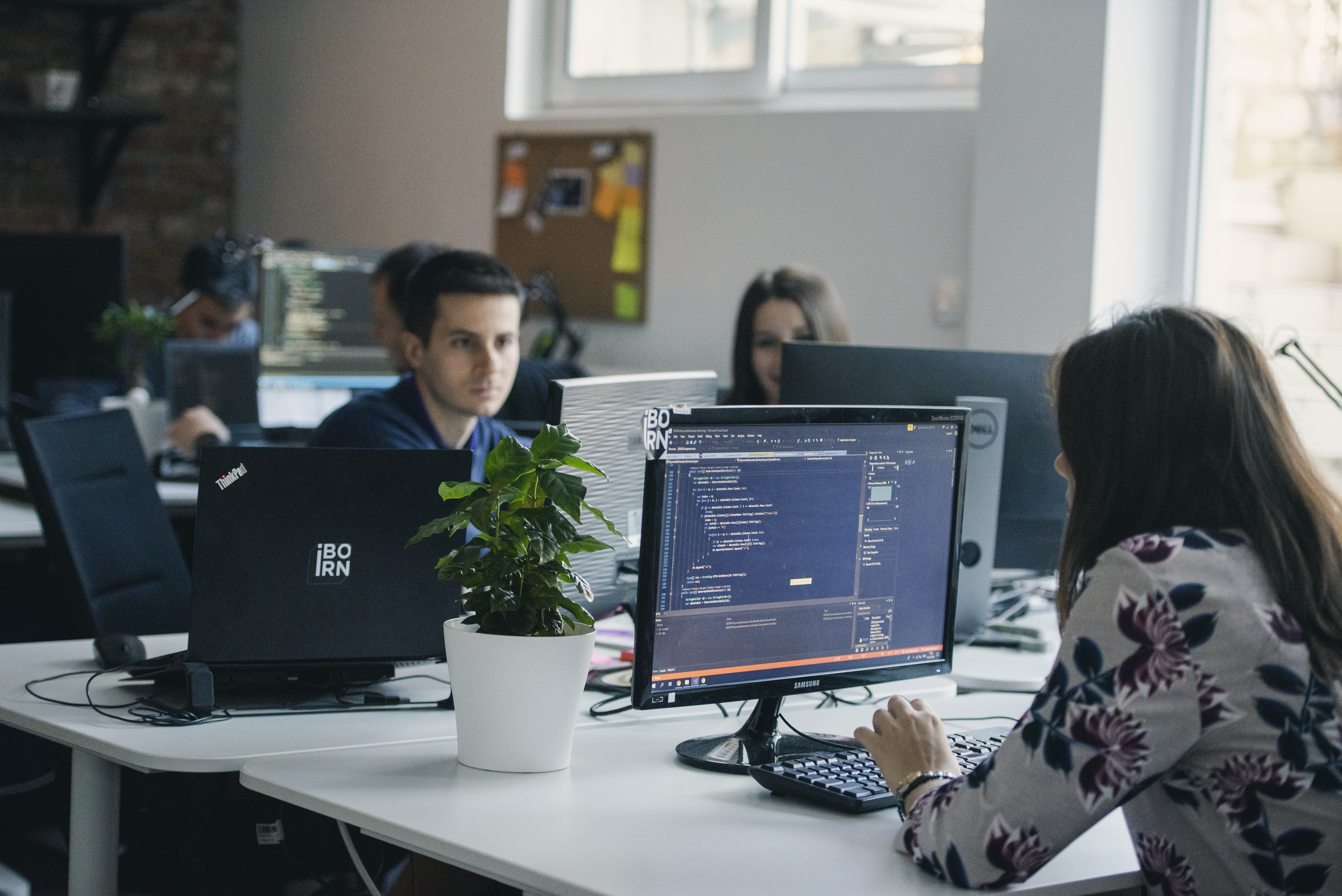 Software engineer working in a modern office environment.