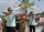 A group of people practicing archery with bow and arrow during a teambuilding.