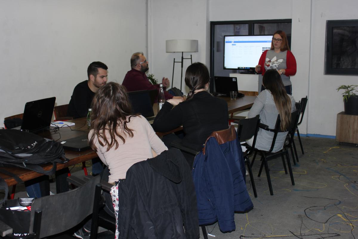 A woman presenting during a quality assurance workshop