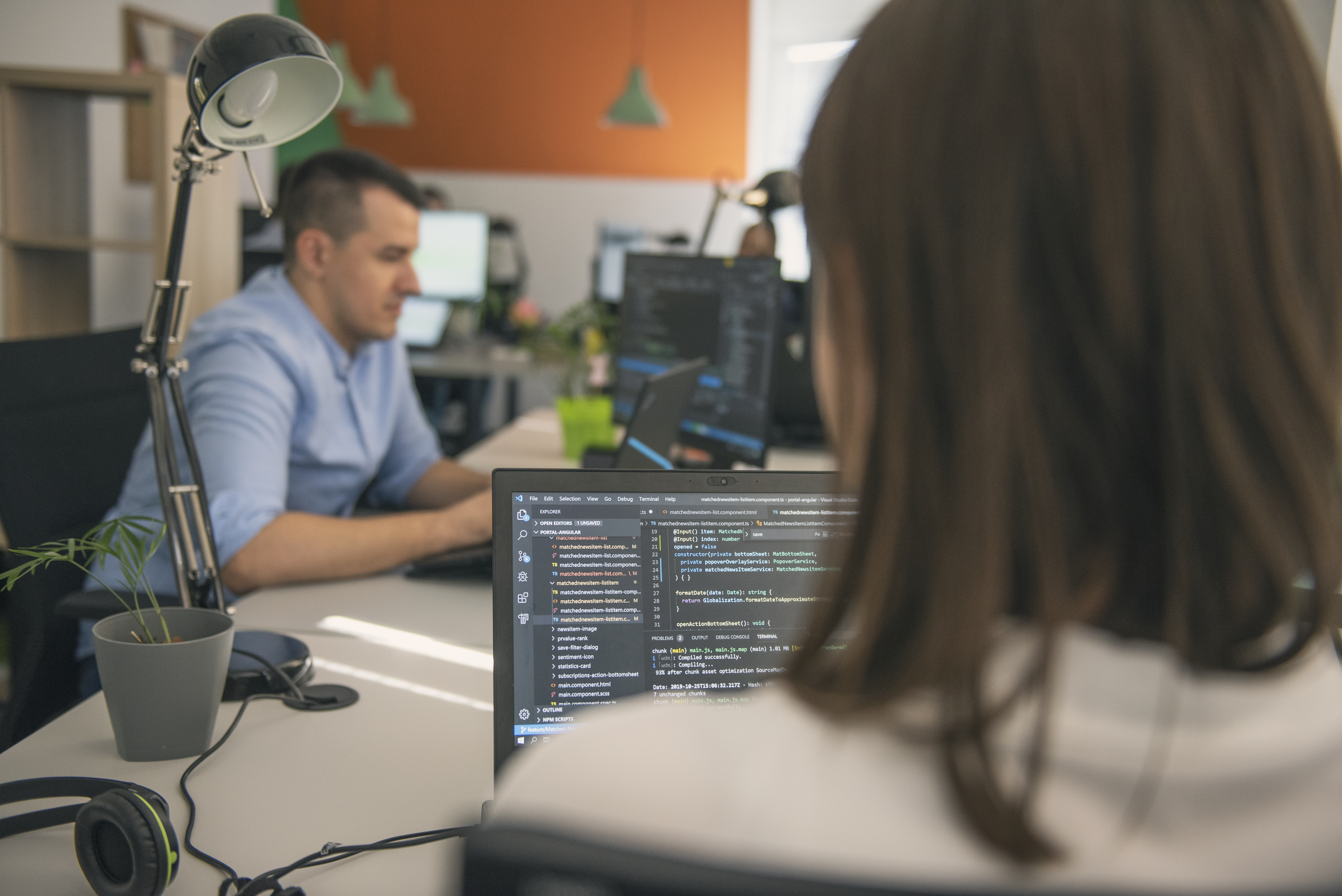 Software developers working together in a modern office.