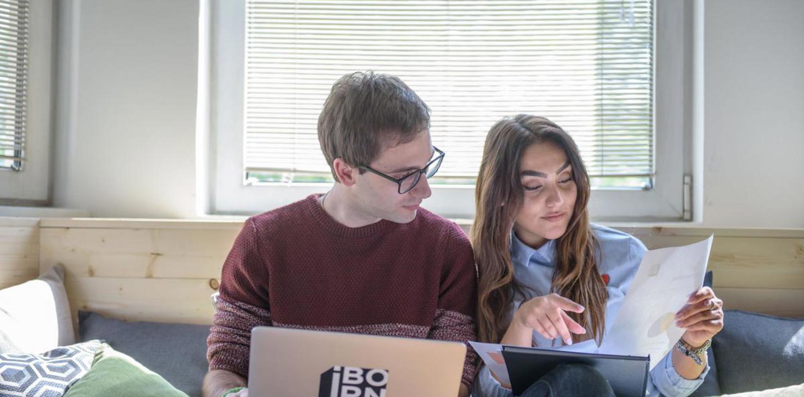 Data engineers working together in a cozy office environment.