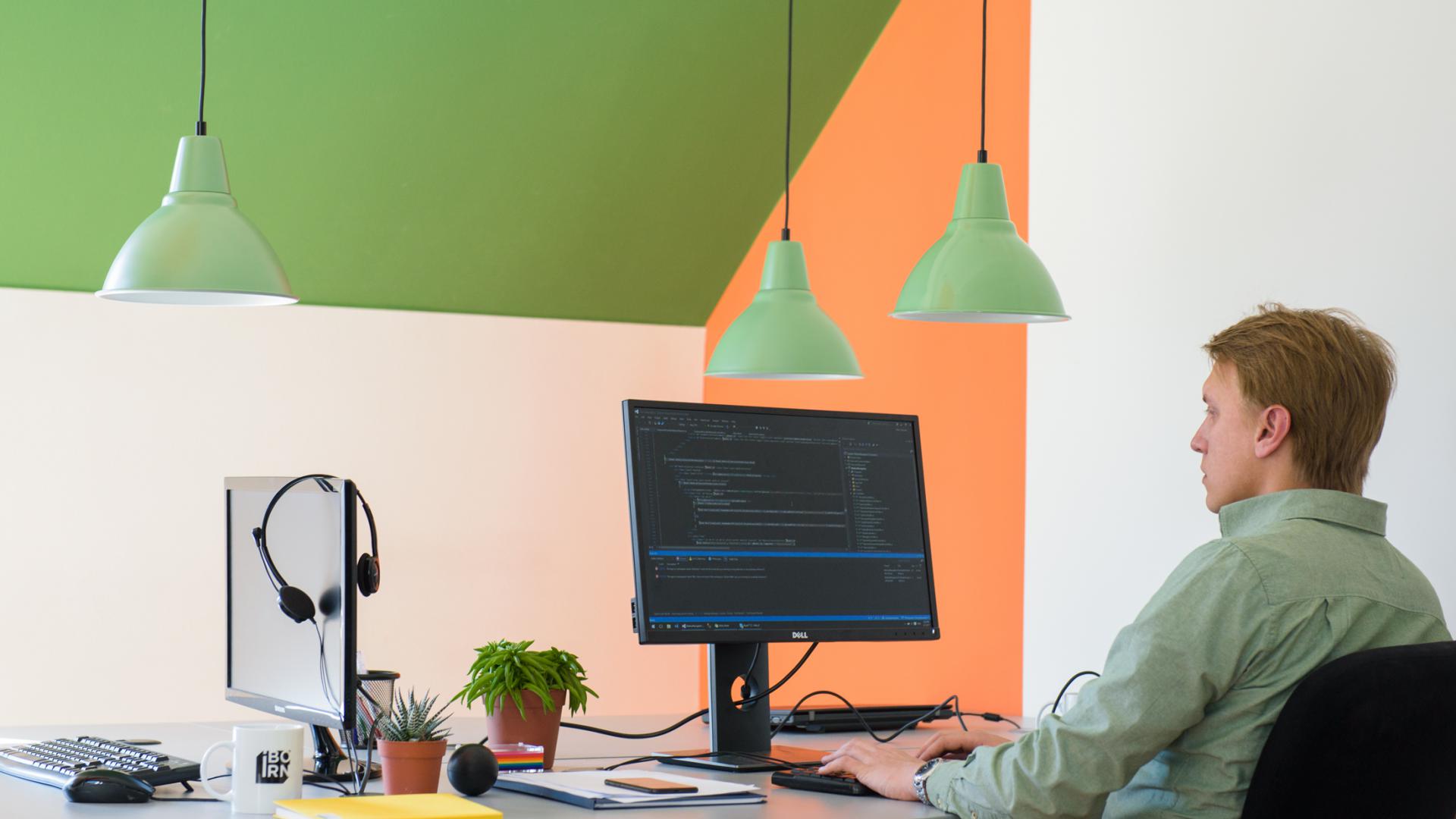 Software engineer working on his computer. 