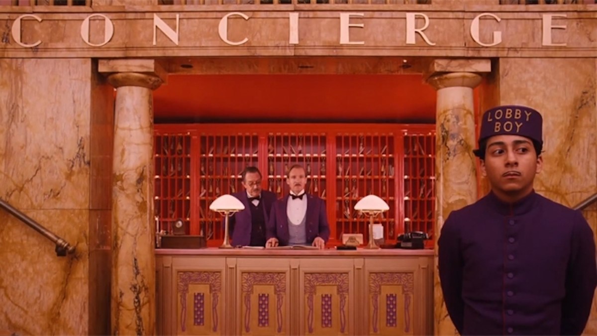 Lobby boy, tourism, and hospitality. Image from the movie The Grand Hotel Budapest.