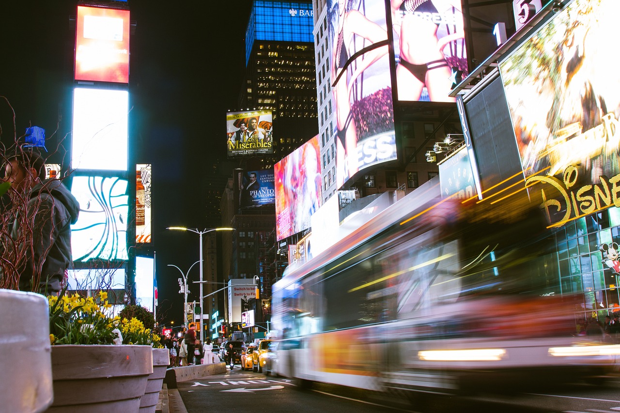 Urban landscape with city lights, signages, and prints.