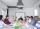 Software development team having a meeting and discussing work in a bright conference room.
