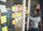 A woman focused on writing post-it notes, planning must-have features for a MVP mobile app.