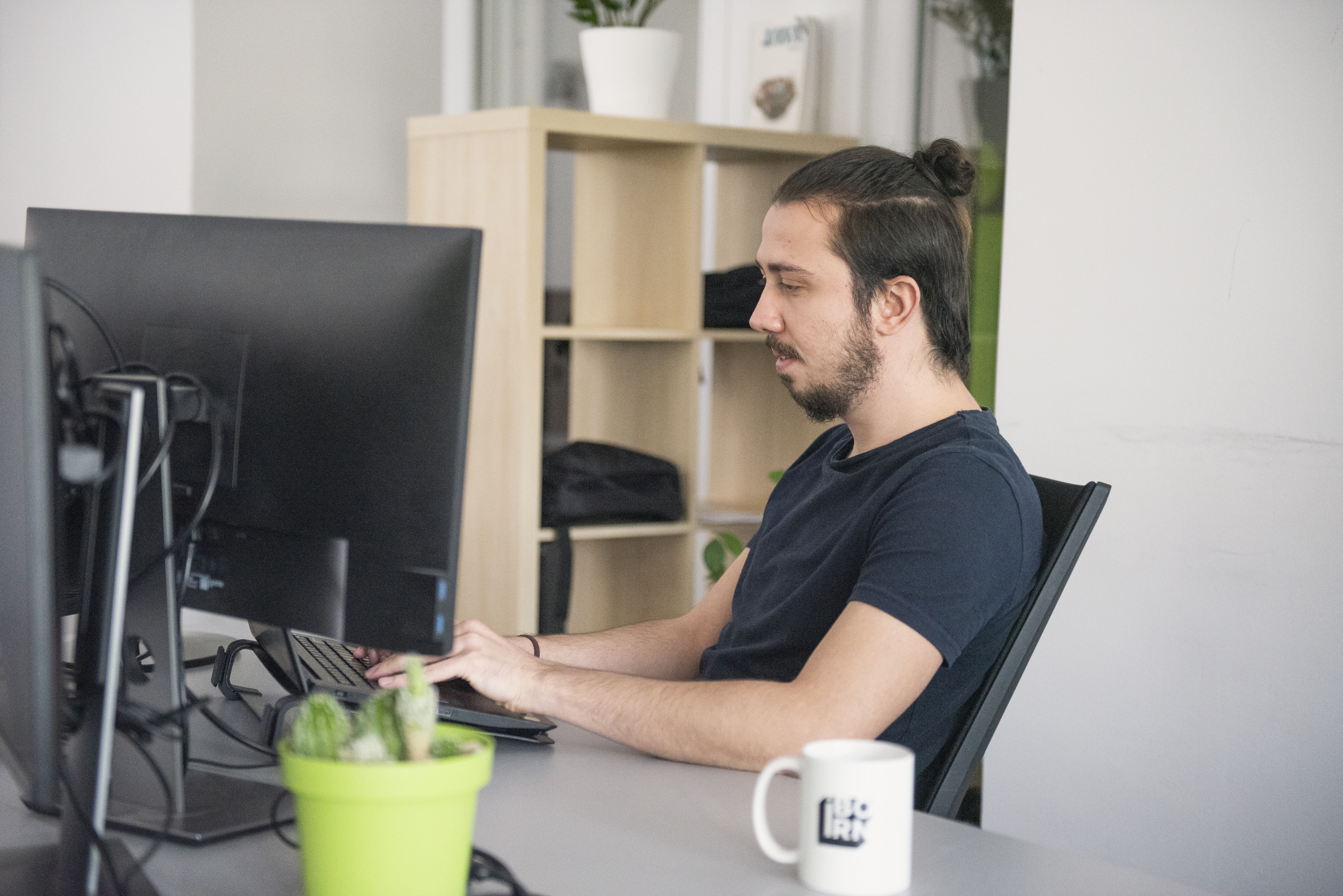 Software engineer working on his computer.