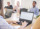 A team of professionals on a meeting using analytic tools and discussing insights into user behavior.