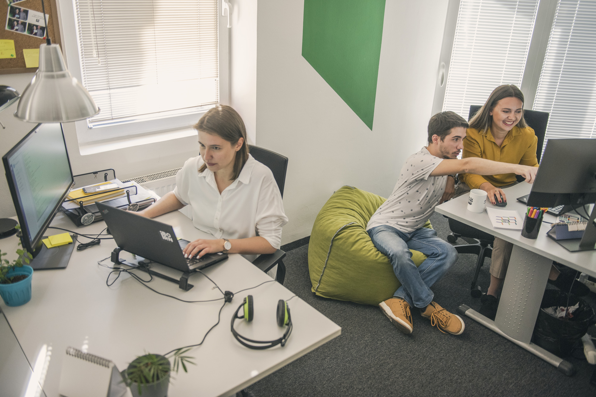 Mobile developers working on a healthcare mobile app in a productive environment.